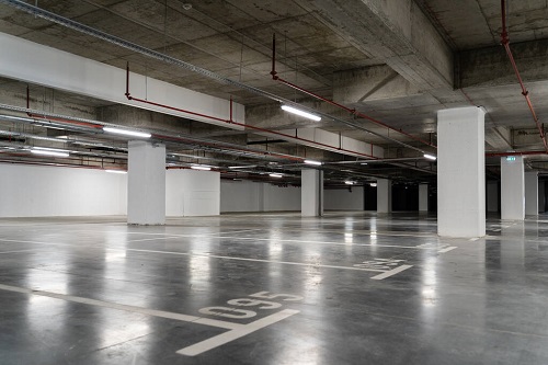 Empty parking at the shopping mall garage city life crisis tranquil scene recession concept تشطيب ارضيات جراجات