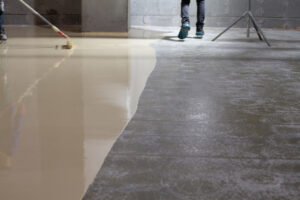 The worker who applied the resistant epoxy resin in the new hall